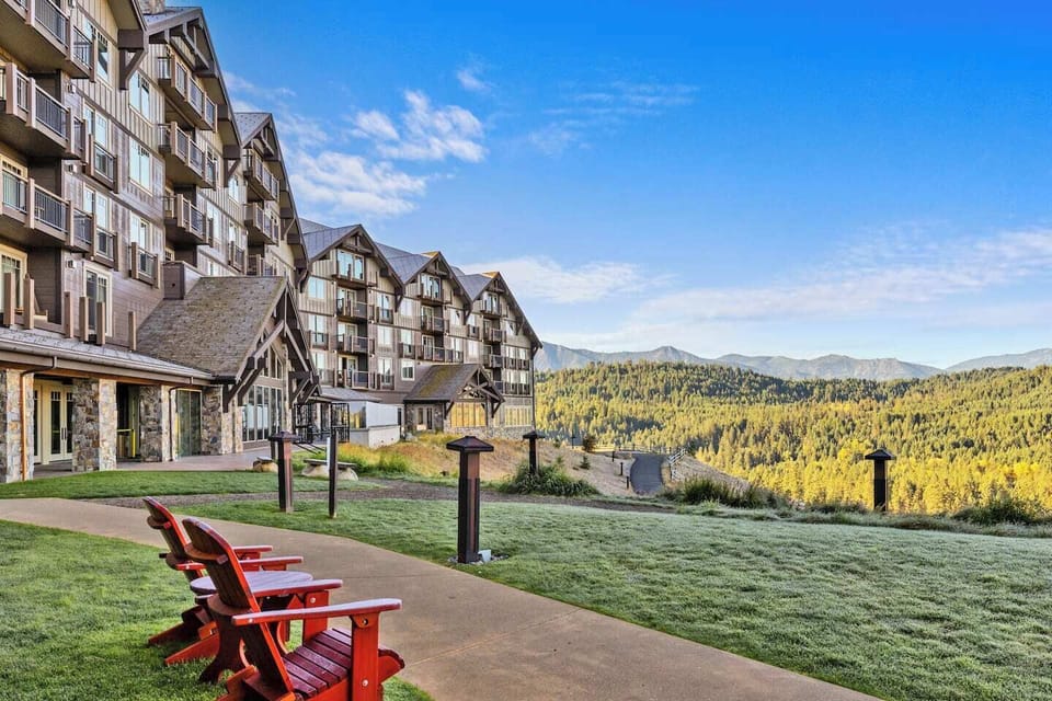 Take in breathtaking mountain vistas from the property’s outdoor seating area, where crisp alpine air and panoramic forest views create a peaceful retreat.