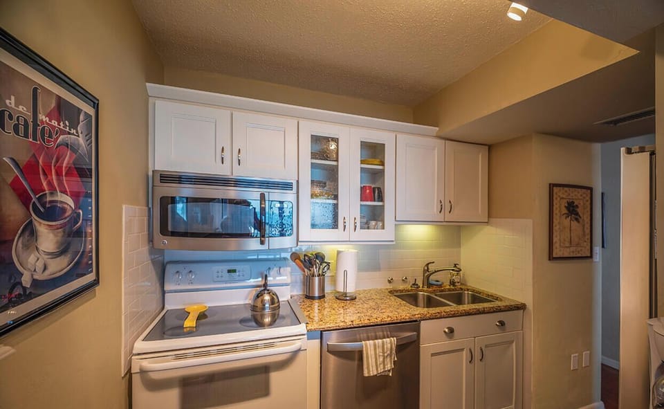 Kitchen is fully equipped and includes a dishwasher.