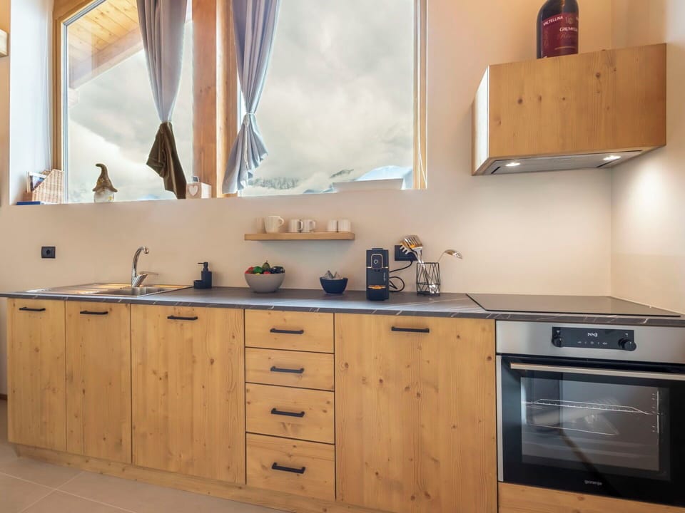 Furniture, Countertop, Kitchen, Cabinetry, Wood, Interior Design, Flooring, Kitchen Appliance, Cupboard, Room