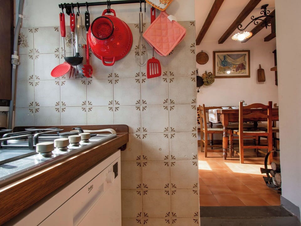 Interior Design, Flooring, Kitchen, Floor, Furniture, Room, Light Fixture, Countertop, Cabinetry, Tile