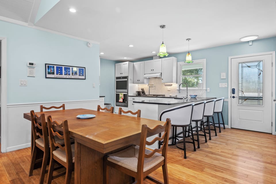 Your spacious kitchen and dining area features modern appliances, granite counters, and seating for memorable meals together.