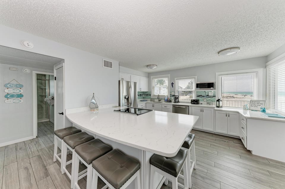 Cook memorable meals together in your spacious kitchen with sleek countertops, modern appliances, and plenty of seating for everyone to gather around.