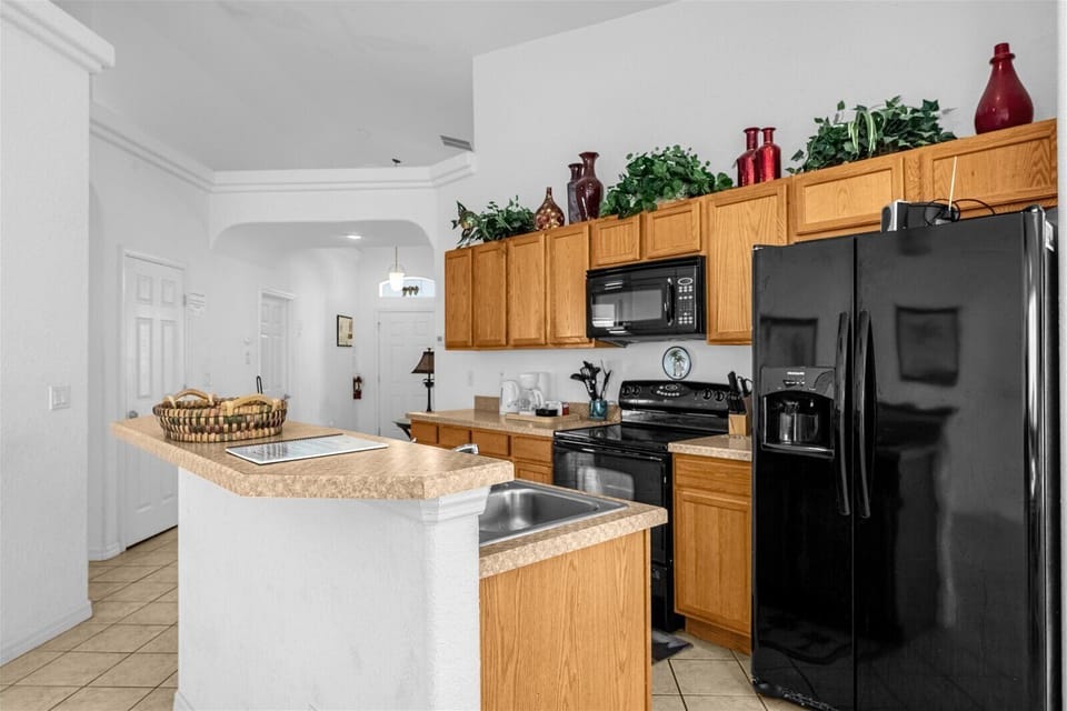Kitchen View with Stove, Microwave, Full Size Fridge, Coffee Maker & Sink