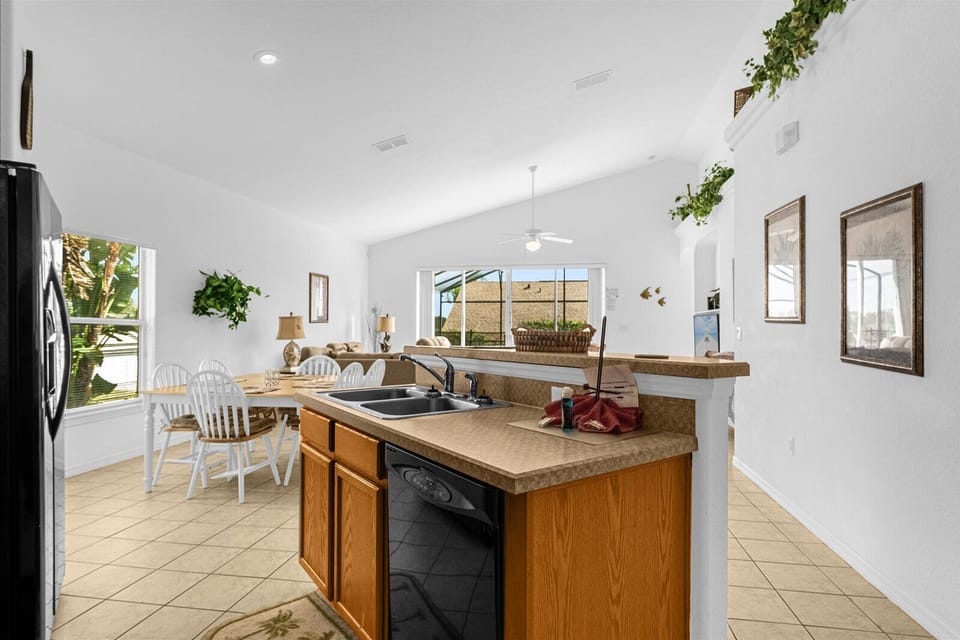 Kitchen View with Sink, Dishwasher & Dining Area that Seats 6 People