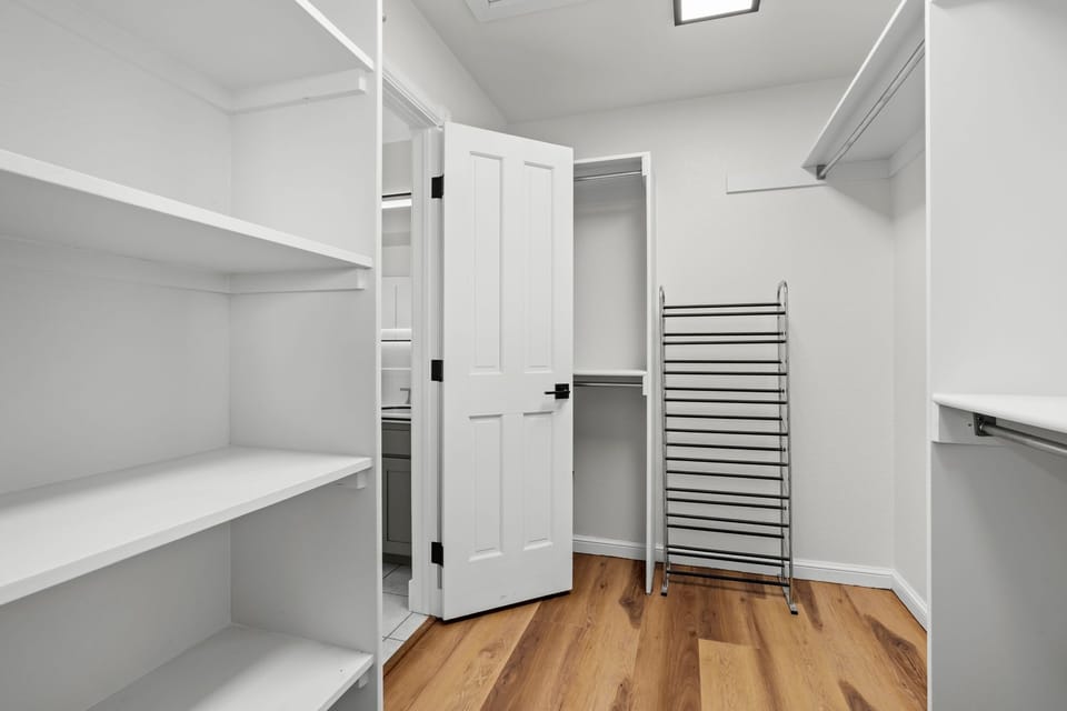 Your spacious walk-in closet offers abundant shelving and hanging space to keep your belongings perfectly organized during your stay.