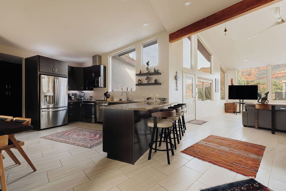 Your spacious kitchen flows seamlessly into the living area, featuring modern appliances and a breakfast bar where you'll love gathering.