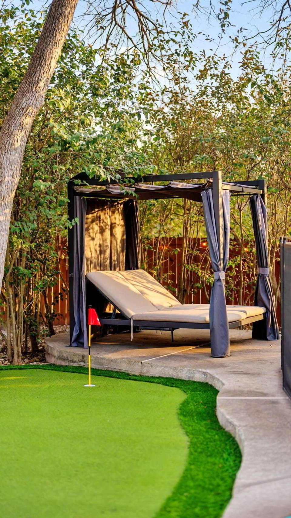 Private backyard cabana lounge — a peaceful spot to relax and enjoy the outdoors.