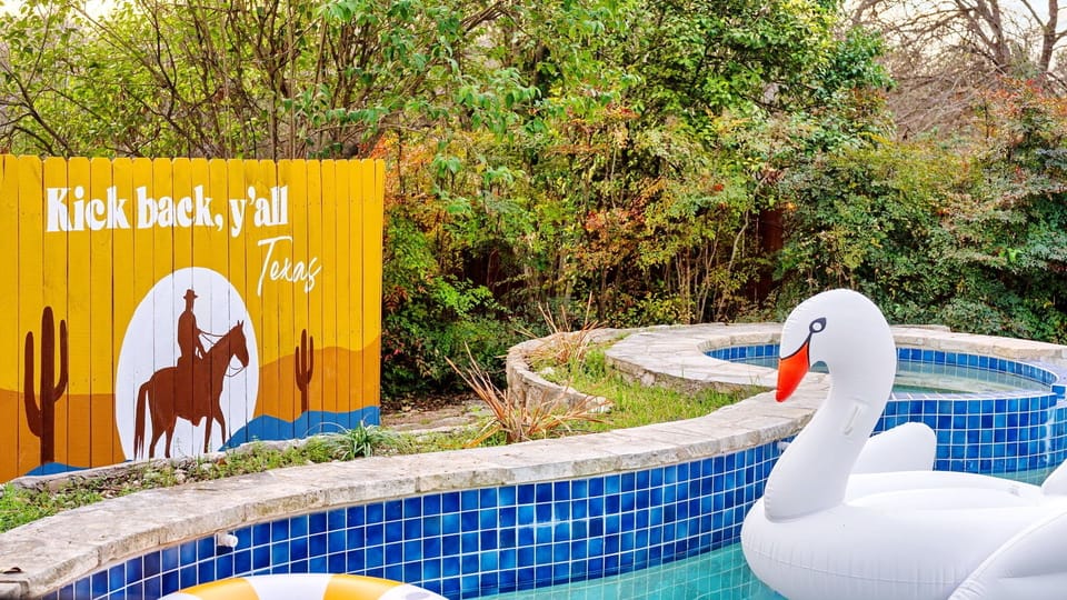 Inviting private pool with relaxing floaties — perfect for cooling off after a day in Austin.