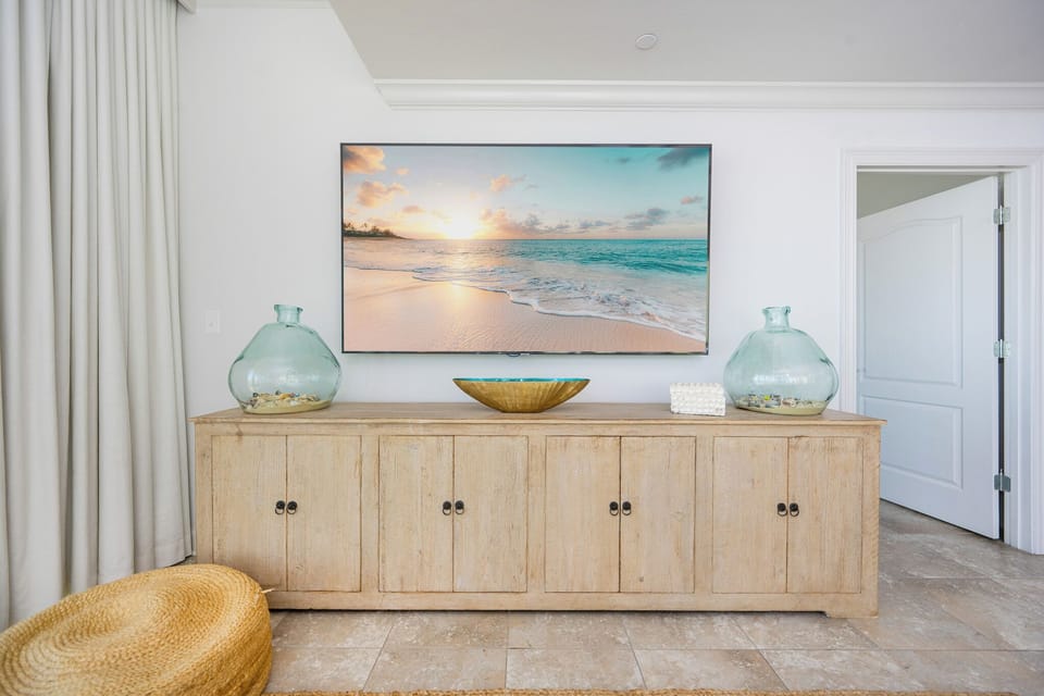 Discover a serene retreat with coastal decor, perfect for unwinding for a movie night