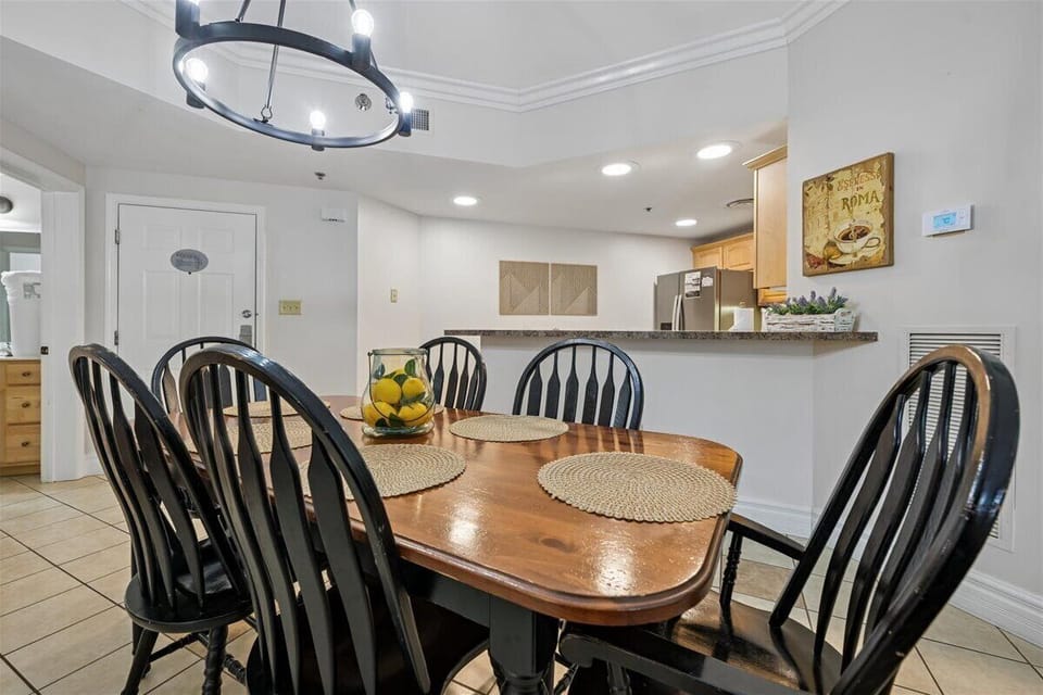 Gather around your spacious dining table for memorable meals with loved ones in this bright, welcoming space.