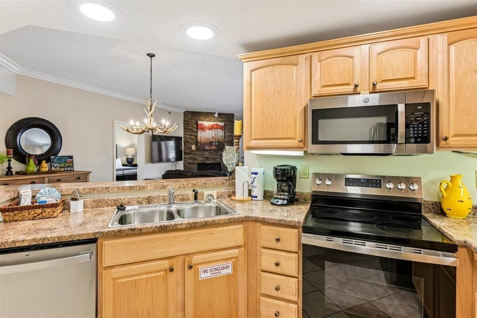 Your fully equipped kitchen awaits with granite counters, stainless appliances, and everything needed to create memorable meals during your stay.