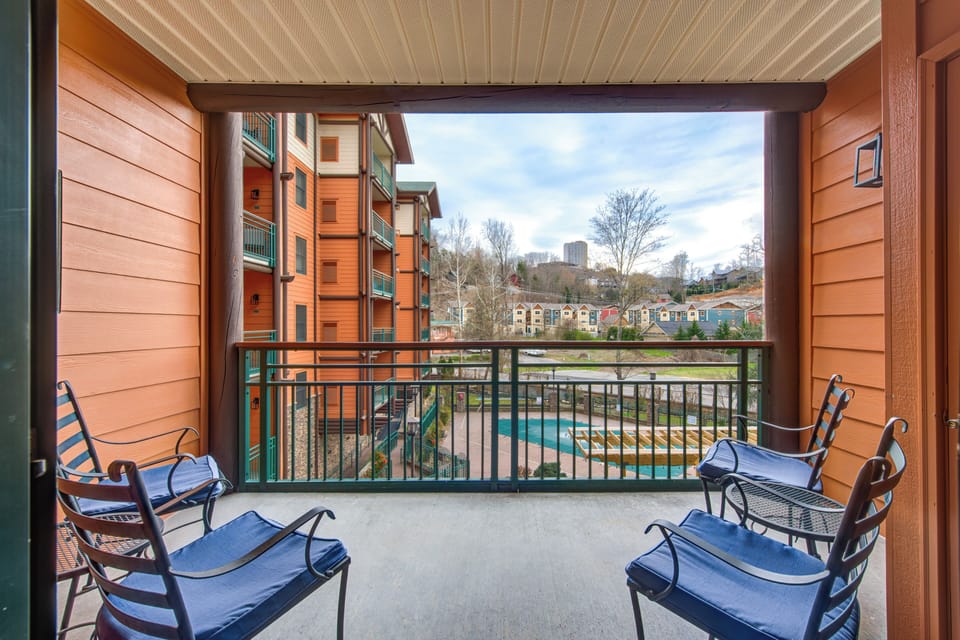 Step onto your private balcony where comfortable seating awaits your morning coffee moments with urban views stretching beyond.
