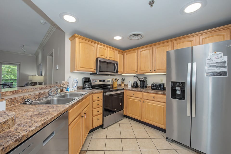 Your fully equipped kitchen features granite countertops, stainless appliances, and all the essentials for preparing memorable meals during your stay.