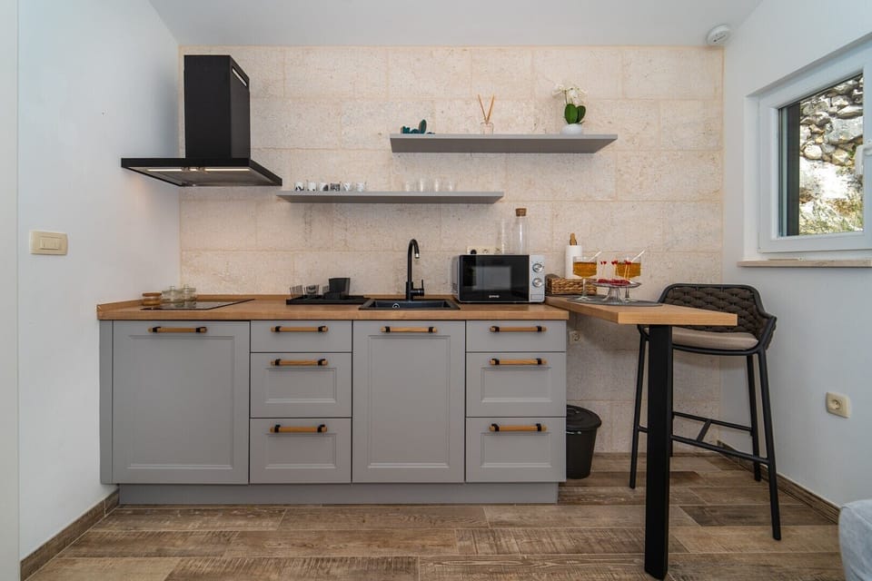 Airconditioned living/dining area and fully equipped kitchen with direct approach to the pool
