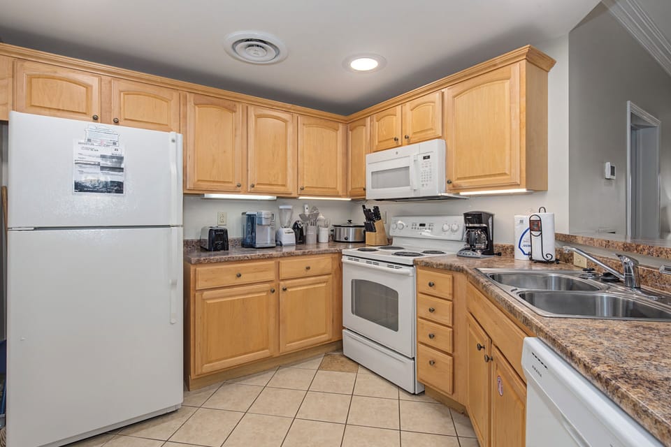 Your fully-equipped kitchen features granite counters, maple cabinets, and everything you need to create memorable meals during your stay.