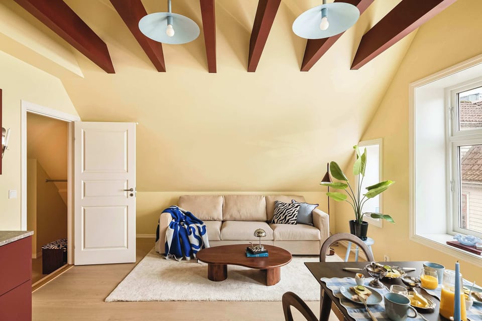 Relax in the bright and spacious living area featuring comfortable seating and warm natural light.