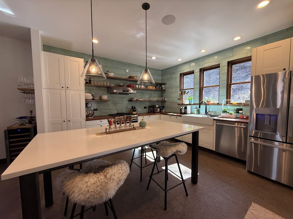 Kitchen with Restoration Hardware lights, filtered water, exposed shelves, mixer