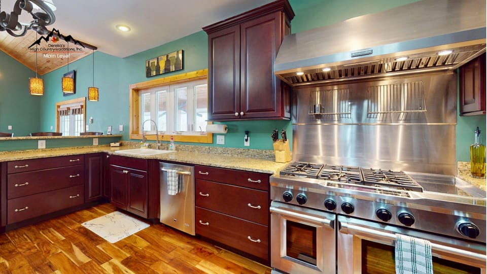 Your gourmet kitchen awaits with professional-grade appliances, granite countertops, and rich cherry cabinets—perfect for creating memorable vacation meals.