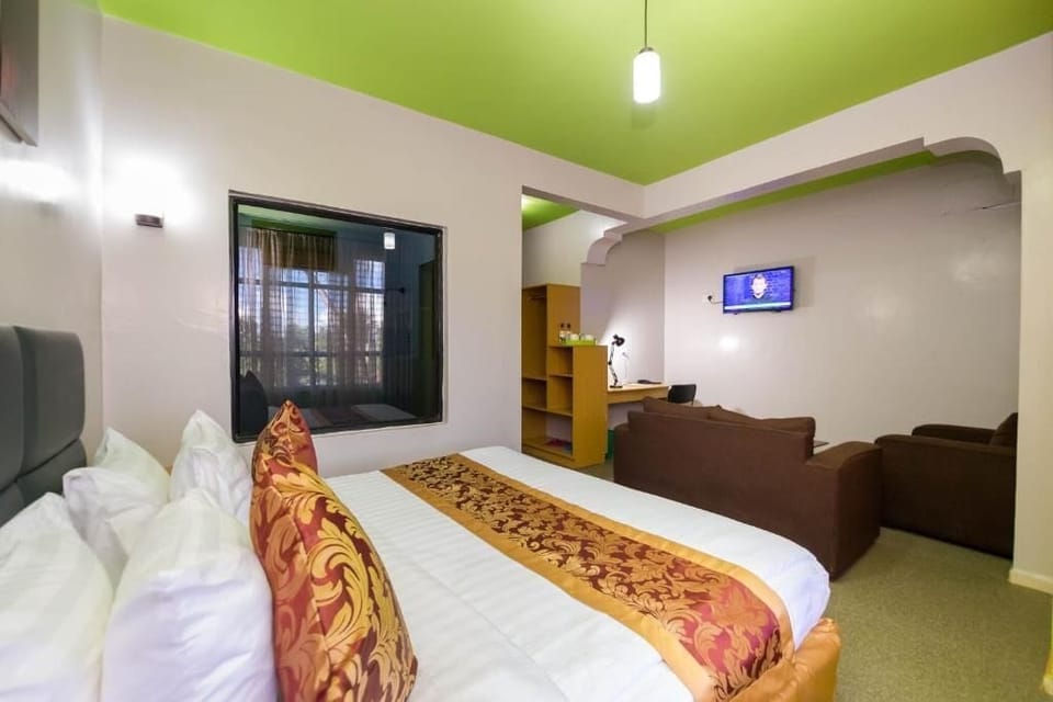 Deluxe Double Room, Patio, Garden View | In-room safe, desk, laptop workspace, soundproofing