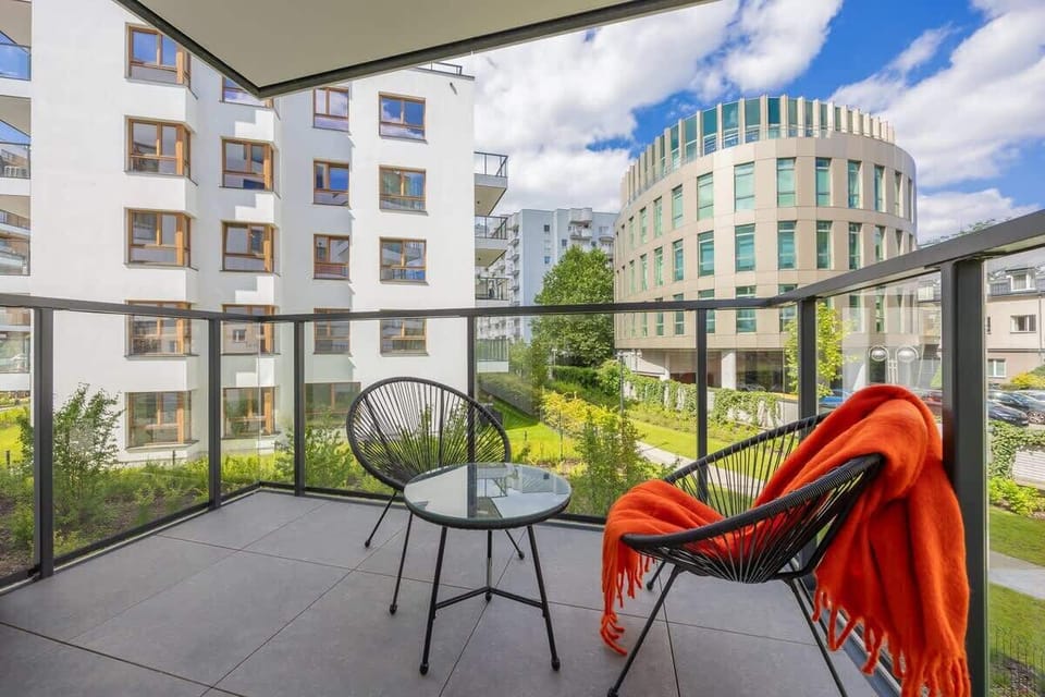 The balcony provides a perfect spot for enjoying the fresh air. 