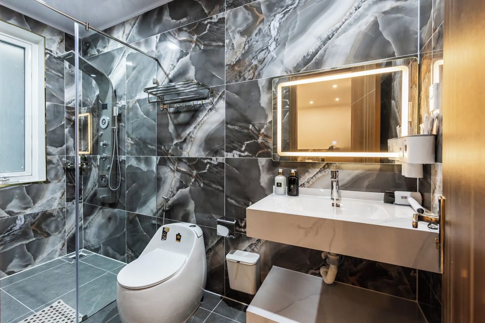 Luxury Triple Room, Courtyard View | Bathroom | Shower, hair dryer, slippers, towels