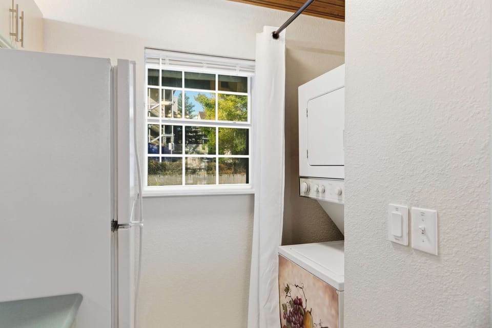 Private laundry is available for your stay, tucked away off the kitchen​