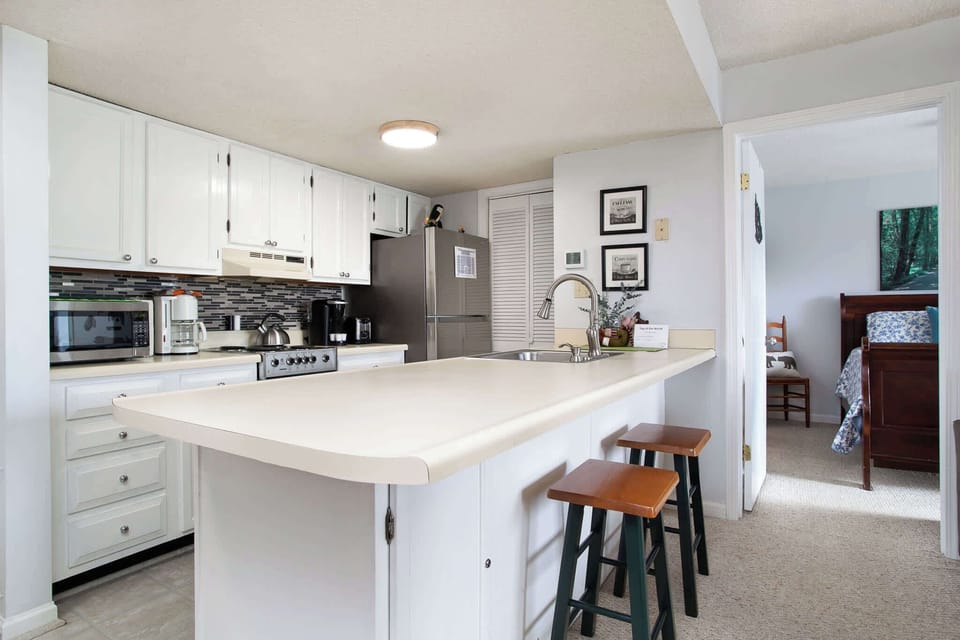 This cozy kitchen offers ample space & all the comforts of home