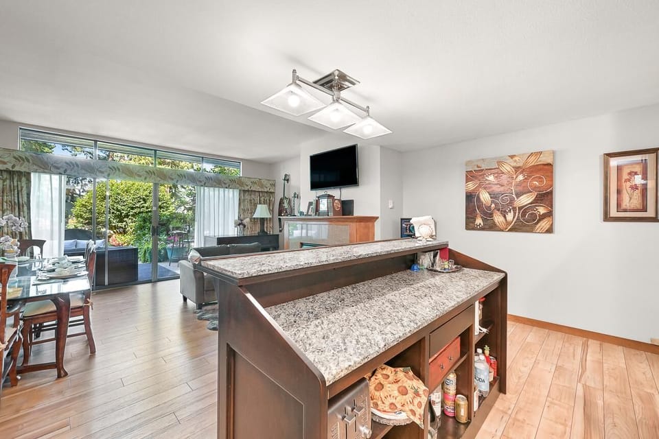 Spacious kitchen with breakfast bar and garden views