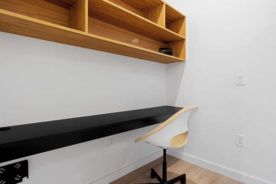 Workspace with desk, chair, and built-in shelving