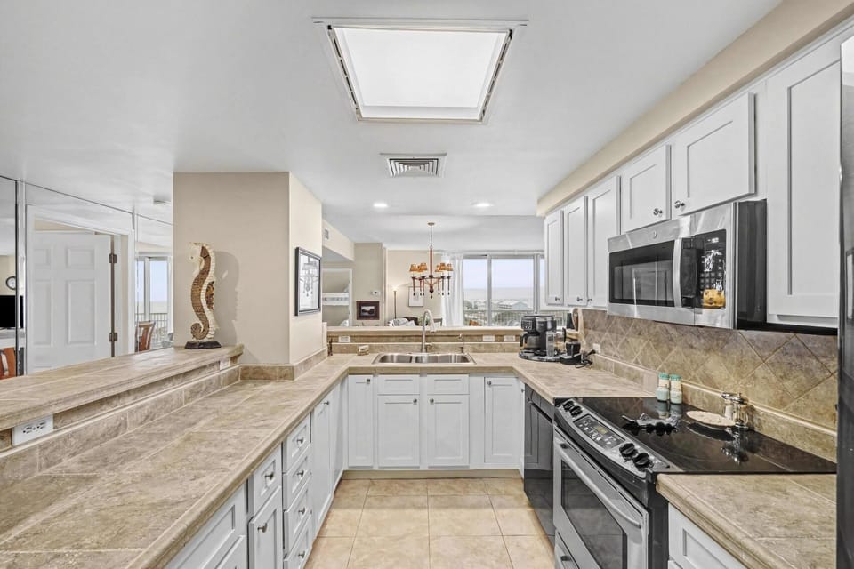 Fully equipped kitchen with modern appliances and ample counter space—ready for everything from quick breakfasts to gour