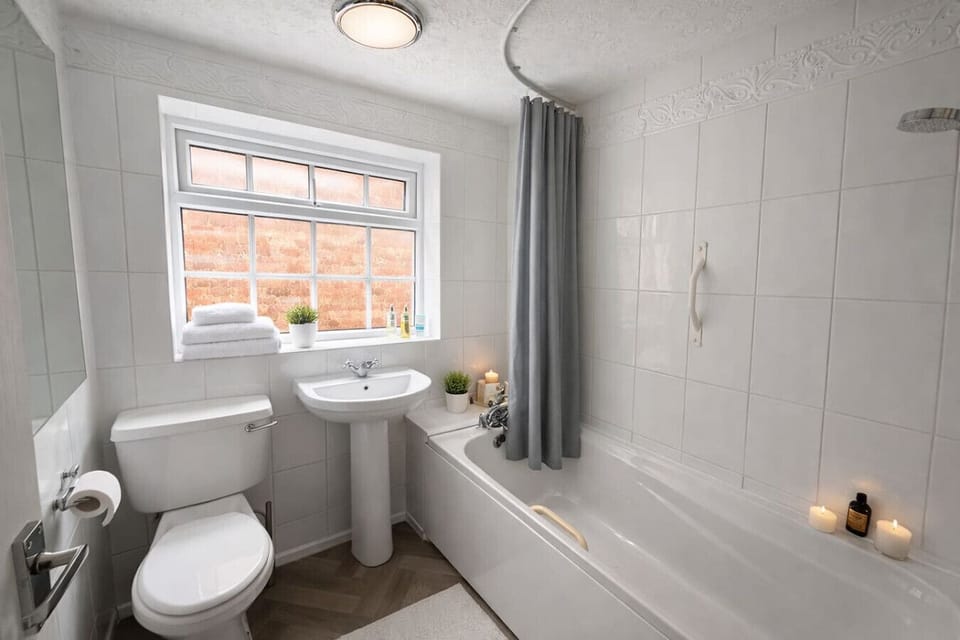 Bathroom with a shower over bath and complimentary toiletries provided.