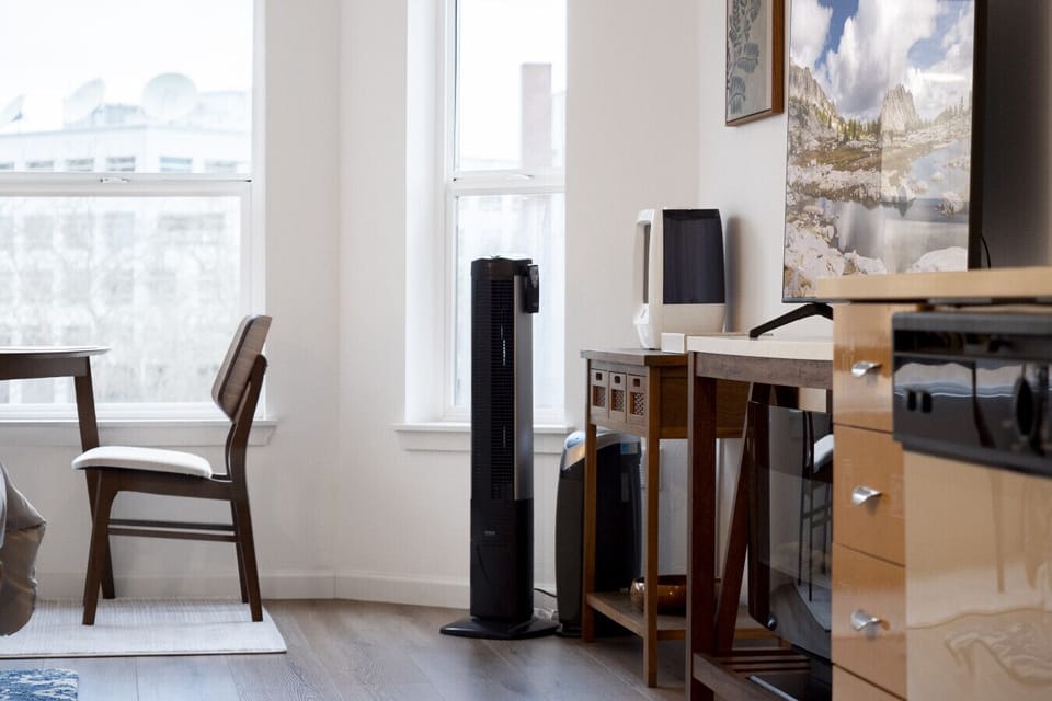 Stay cool and comfortable with plenty of natural light and a modern tower fan.