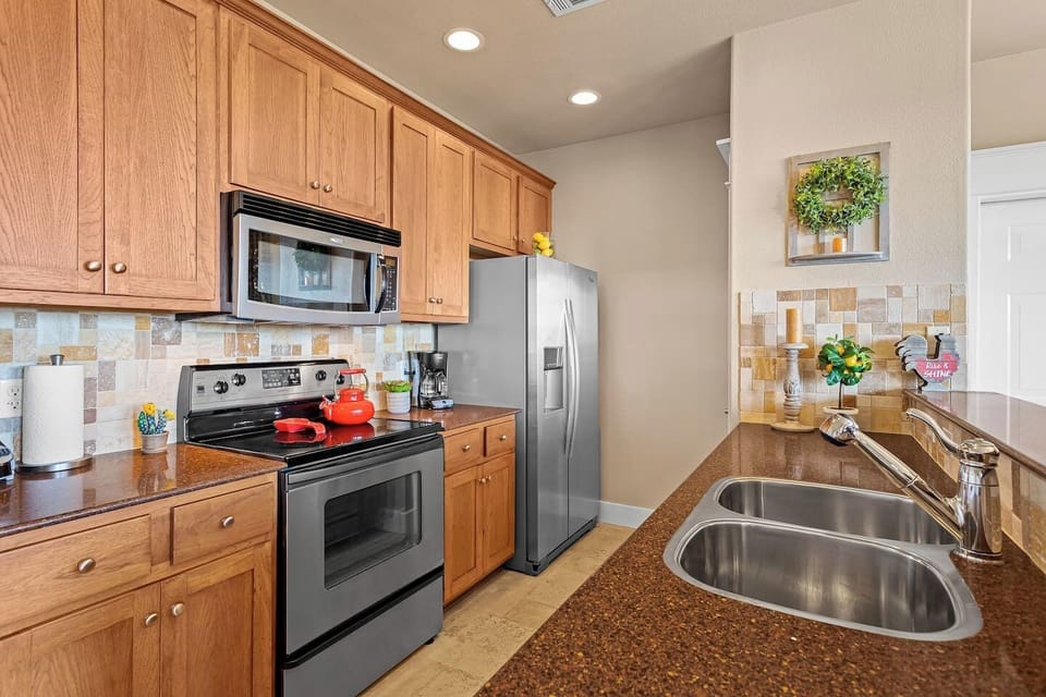 Well-appointed kitchen featuring full-size appliances, ample counter space, and everything needed for meals, snacks, and extended stays