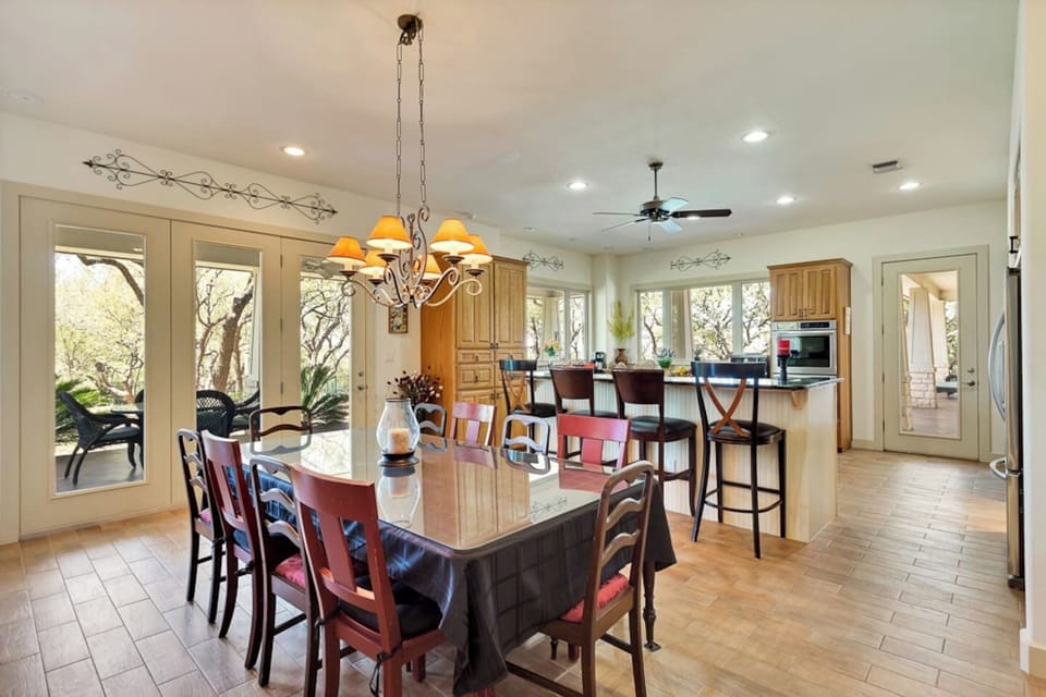 Dining room and bar seating kitchen area, perfect for shared meals, morning coffee, and gathering together during your Lago Vista getaway