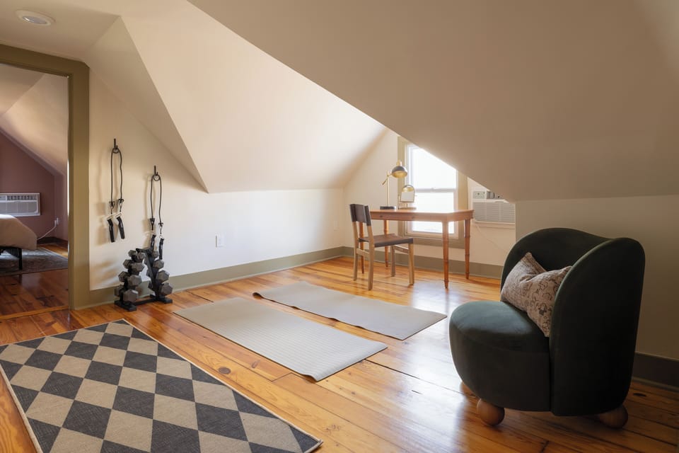 Loft Den: Sunny space with a yoga nook, desk, and reading chair!