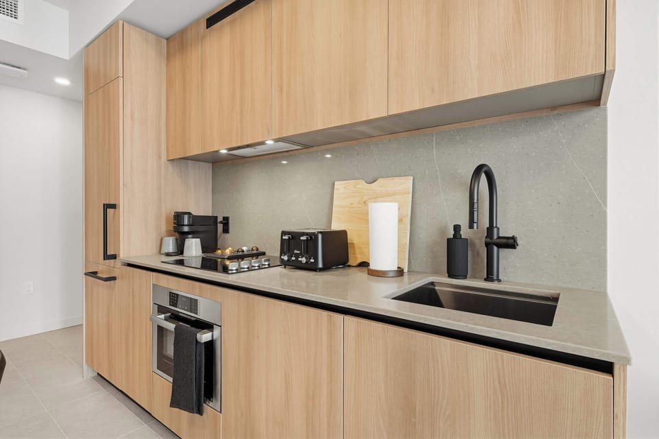 Modern Kitchen: Fully equipped with sleek cabinetry and premium appliances