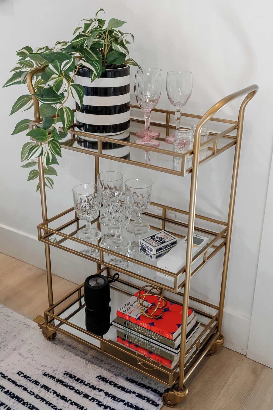 Modern bar setup with glassware and decorative touches, perfect for a cozy night in.