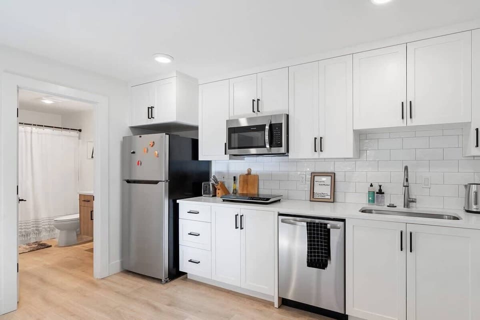 Fully stocked modern kitchen with sleek cabinetry and stainless appliances, perfect for everyday cooking.