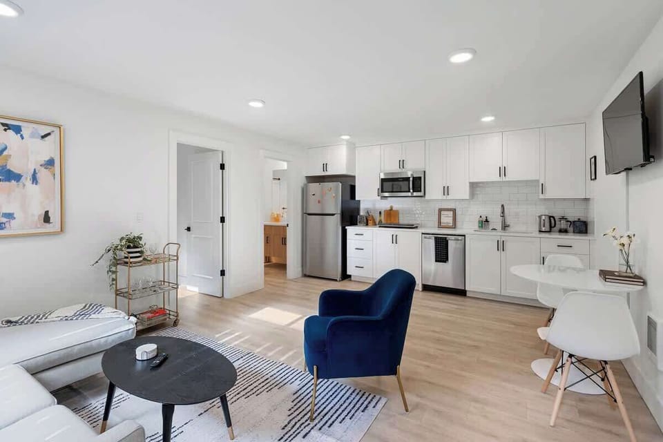 Light-filled living and kitchen area with contemporary design & dining space—perfect for relaxing and dining in.