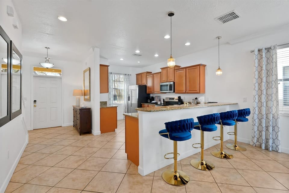 Cook and connect in a modern kitchen with counter seating for four.