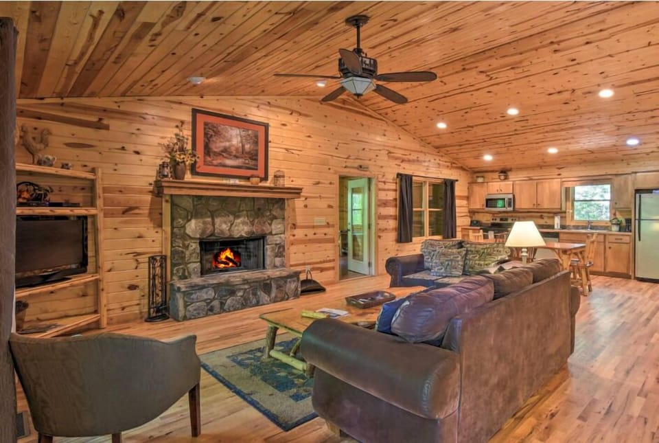Cozy up with a book in front of the Wood Burning Fireplace