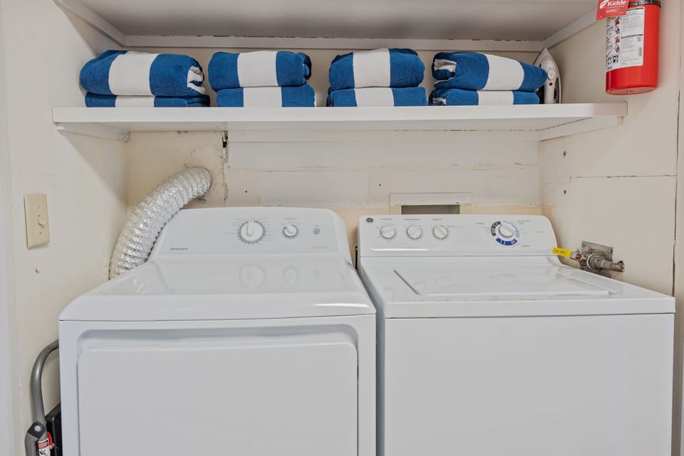 Laundry closet, conveniently located in the kitchen.