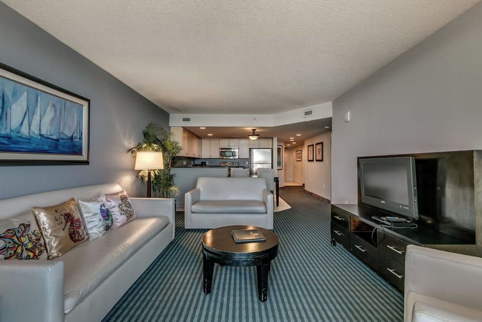 Open layout living room dining area and kitchen