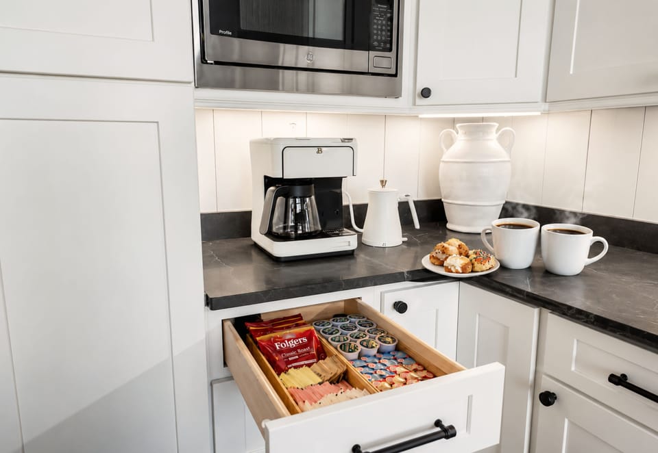 Mornings begin gently here. Open the coffee drawer, breathe in the aroma, and sip slowly as Lake Blue Ridge glows beyond the windows. A sweeter start to your wellness retreat.