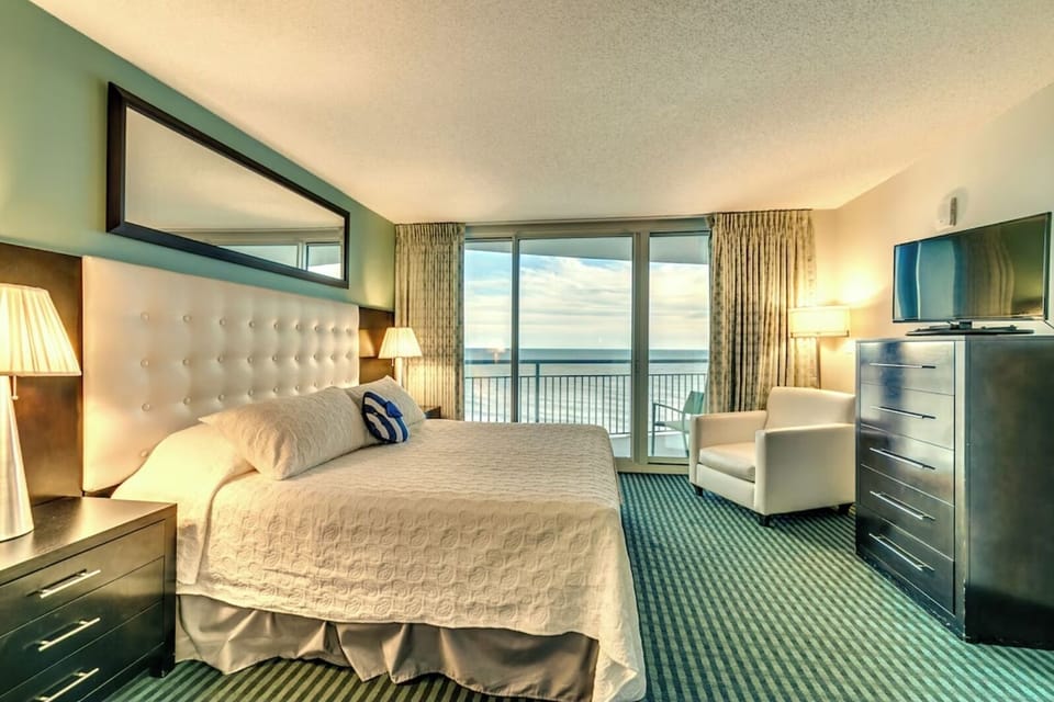 The room is thoughtfully furnished with plush seating and contemporary décor, 