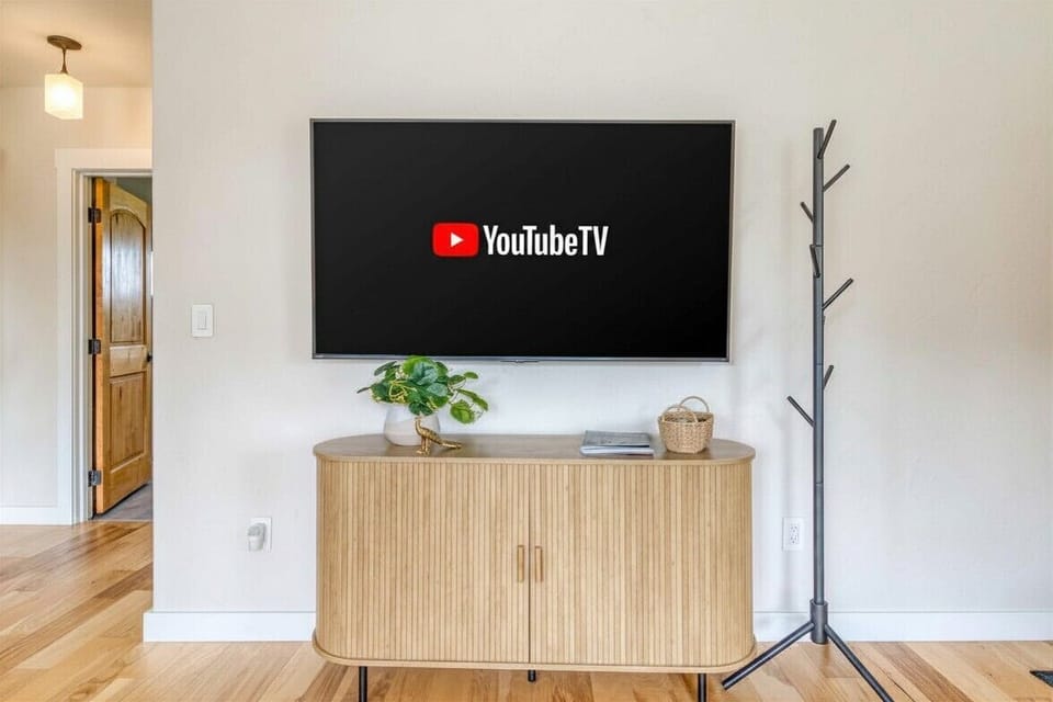 Enjoy 65" smart TV with YouTube TV for entertainment, movie nights, and relaxing