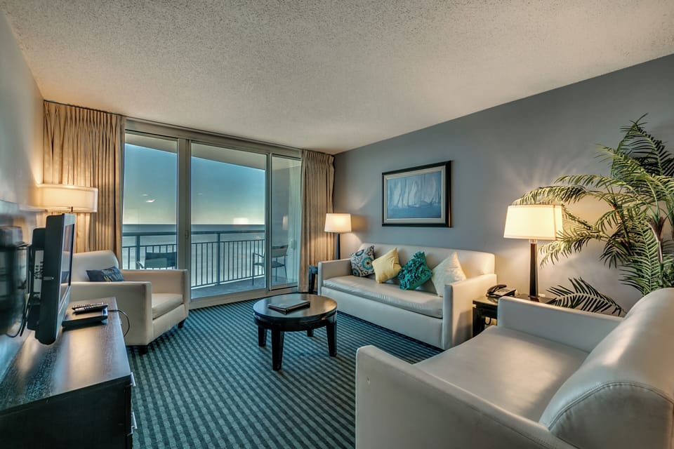 Living room is thoughtfully furnished with plush seating and contemporary décor,