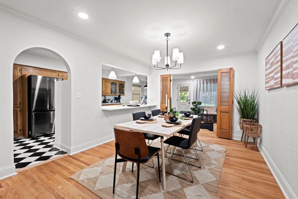 Main-level dining area with seating for up to 6 and open flow to the kitchen. Perfect for family dinners, holiday gatherings, and shared moments.