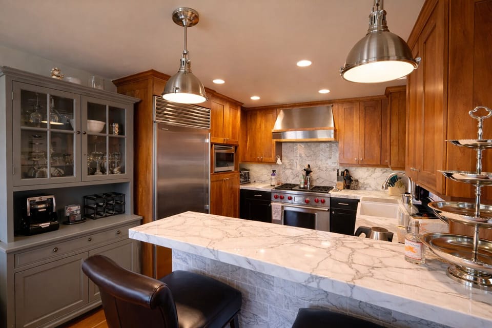 Enjoy casual dining and morning coffee at the oversized island, with open sightlines to the kitchen—ideal for entertaining and staying connected.