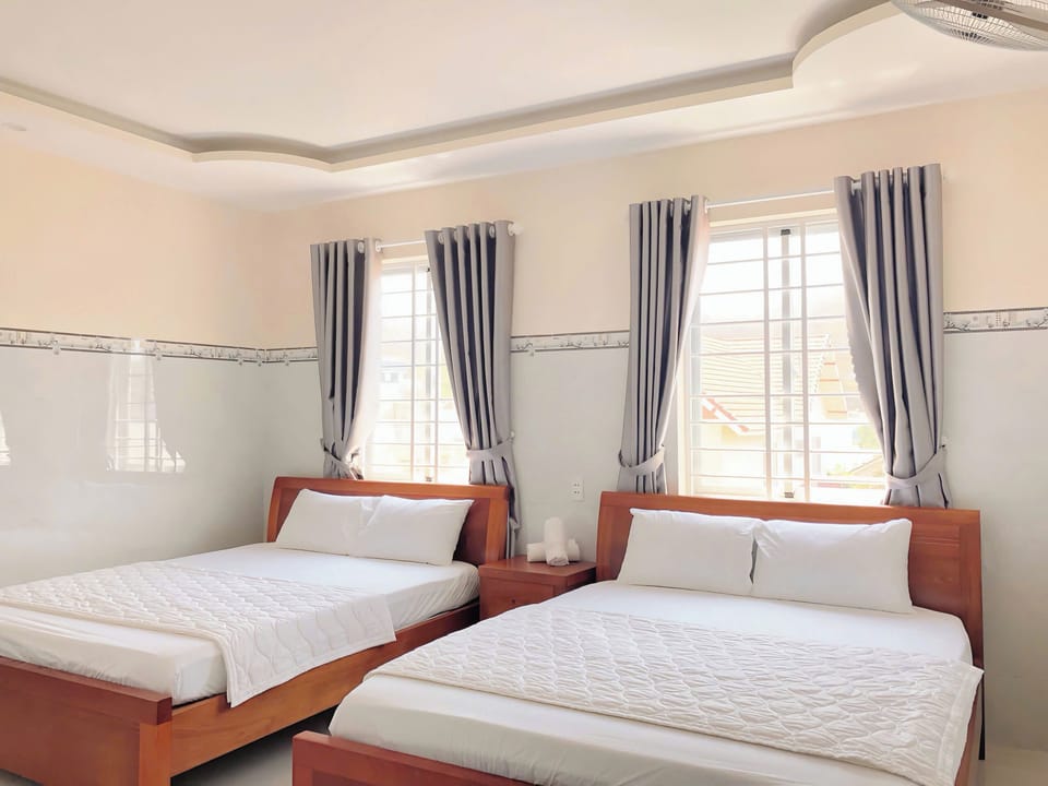 Standard Quadruple Room, City View | Desk, free WiFi